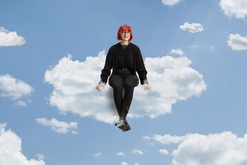 Woman with red hair and glasses sitting on a cloud