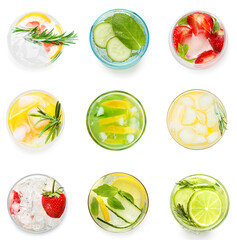 Set of glasses of cold infused water on white background, top view