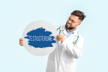 Doctor with blank poster on color background