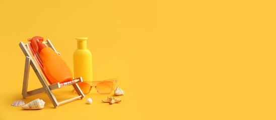 Deckchair, bottles of sunscreen cream, seashells and sunglasses on yellow background with space for...