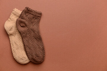 Different basic color socks on brown background