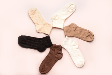 Frame made of basic color socks on beige background