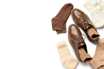 Basic color socks and stylish shoes on white background