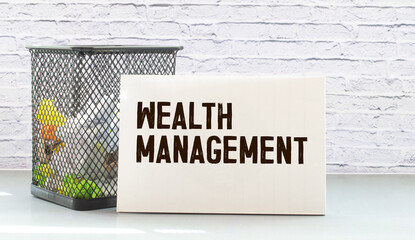 On business sign with the inscription - wealth management