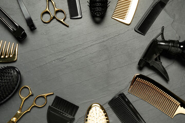 Frame of hairdressing tools on grey textured background, flat lay. Space for text