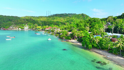 Tranquil Tao Island, nestled in azure waters, captivates with lush greenery and pristine beaches,...