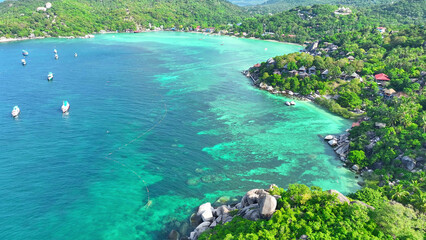 Koh Tao, Thailand, boasts crystal-clear waters, vibrant coral reefs, and palm-fringed beaches,...