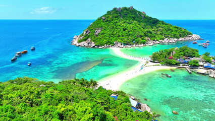 Discover a tranquil haven with pristine beaches, a unique sandbar, and crystal-clear waters perfect for unforgettable snorkeling adventures. Bird's eye view. Sea background. Koh Nangyuan, Thailand.
