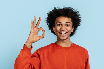 Black man giving OK sign with hand