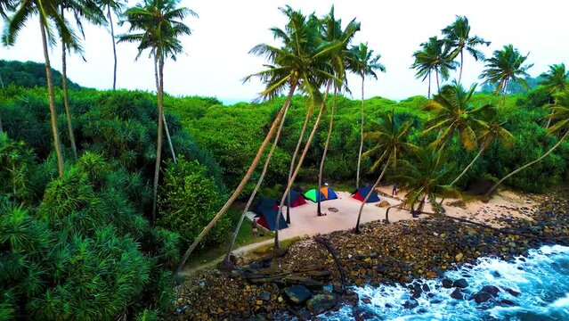High quality aerial view video clip of Blue beach Island in Nilwella Sri Lanka | Travel | Drone video | Island | Beach | Ocean | Beach camping