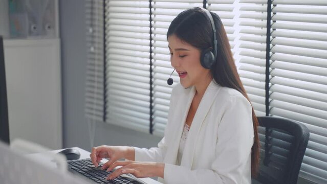 Asian beautiful business woman call center working in office workplace.
