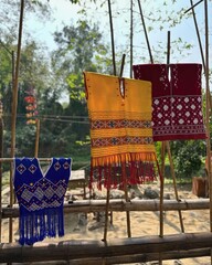 Clothes hung to dry in the sun on bamboo sticks After washing