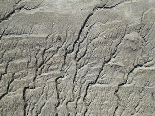 top view of water erosion on unvegetated land
