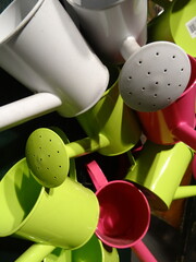 multicolored watering cans
