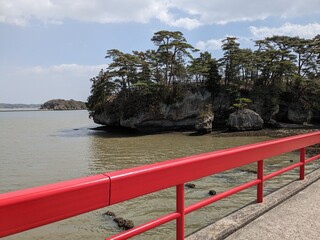 Fukuura island accessible via a long red bridge in matsushima bay