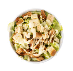 bowl of iceberg lettuce leaf salad with croutons and cesar dressing top view isolated