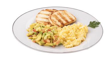 plate of scrambled eggs with guacamole and slices of natural toast as a healthy breakfast in angle