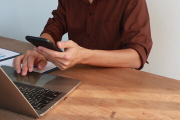 businessman, male, has insurance documents. Insurance helps him protect things. Documents are papers with information. He keeps them safe. Important for safety and security