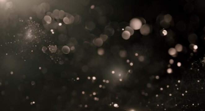 Cosmic Dust and Particles. Abstract swirls of shimmering dust and particles on a dark backdrop.