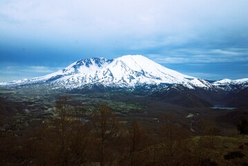 Mount St Helens and the surrounding parkland, taken from a high vantage point on a cloudy day. 