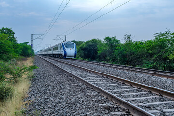 Fototapeta premium The Solapur Mumbai Vande Bharat Express Train heading towards Mumbai, near Pune India.