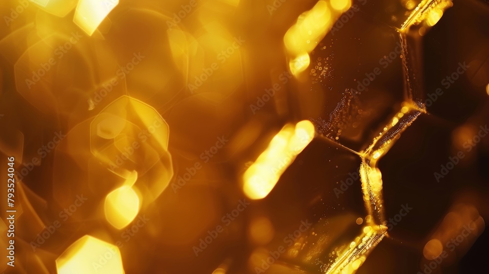 Poster close-up of shimmering golden hexagon shapes with a soft bokeh background for a luxurious feel.