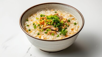 Gourmet top shot of Congee, creamy rice porridge enhanced with shredded chicken and green onions, on a clean white background, studio lighting
