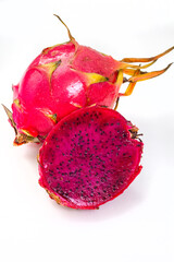Purple dragon fruit, cut open, isolated on white