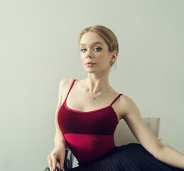 portrait of a young ballerina in a black tutu