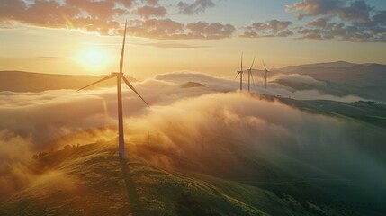 Wind turbines seen through a misty sunrise