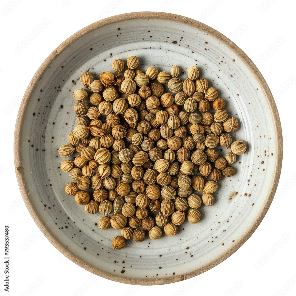 Wall mural a close up shot of aromatic coriander seeds neatly arranged on a ceramic plate stands out against a 