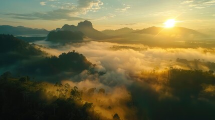 Good morning at sunrise with mist in the mountain and sky background.The location is Phu Langka in Phayao province, Thailand