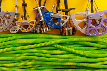 mountaineering equipment. green rope and sports equipment for safety in the mountains. adventure and sport concept.