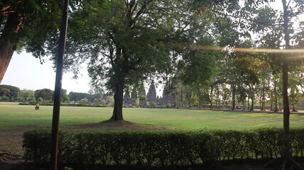 View of the temple in the ancient Prambanan temple complex with the evening sky in the background. Popular tourist destination.