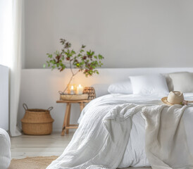 Fototapeta na wymiar Bedroom in neutral tones and minimal decor bathed with natural light coming from a window. Interior design chic bedroom composition.