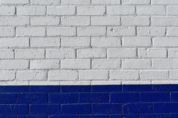 A blue and white painted brick wall; for abstract background graphic design; the colours a symbol of Israel, Greece or Finland  national culture, customs and flag.