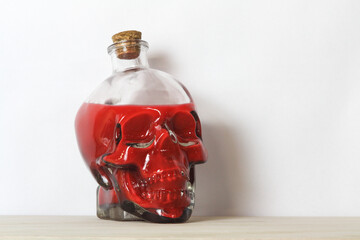 Human skull containing blood or poison