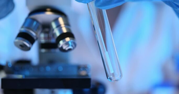 Using a sterile swab to collect a bacterial sample in a test tube