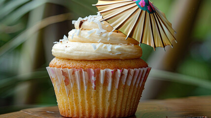 A cupcake with creamy coconut frosting and a tiny, edible paper umbrella on top, invoking the spirit of a tropical birthday getaway.