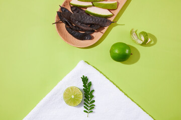 Template of natural ingredients for cosmetic with black locust pod, lime, grapefruit peel and fern...