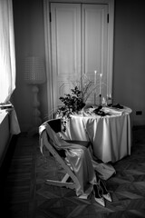 Elegant Wedding Dinner Table Setting with White Flowers and Champagne Glasses - Festive Atmosphere