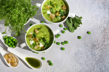Refreshing Summer Pea Soup with Crispy Croutons, Sour Cream, Fragrant Mint, Pea Shoots, and Vibrant...