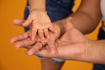 Family motherhood fatherhood childhood hands together