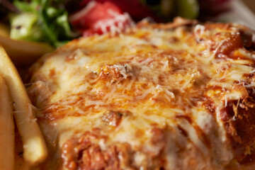 Cheese pork cutlet on a plate