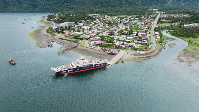 Ferry Boat Moored At Hornopiren Town Located In Commune Of Hualaihué in Palena Province, Southern Chile. Aerial Circle Dolly Shot