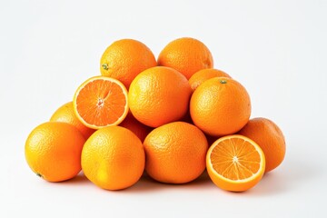 Pile of Fresh Oranges With a Halved Orange on Top Against a White Background