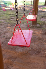 wooden and metal playground swing