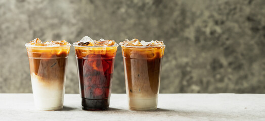 Ice americano and cafe latte on the table - obrazy, fototapety, plakaty