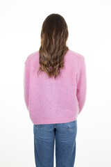 Rear view of unrecognizable slim young woman with long hair back on white background in studio shot lady pink sweater jeans behind view