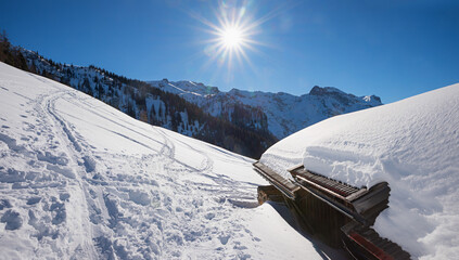 winter landscape with hut and bright sun, Zwolferkopf mountain pertisau - 793618497